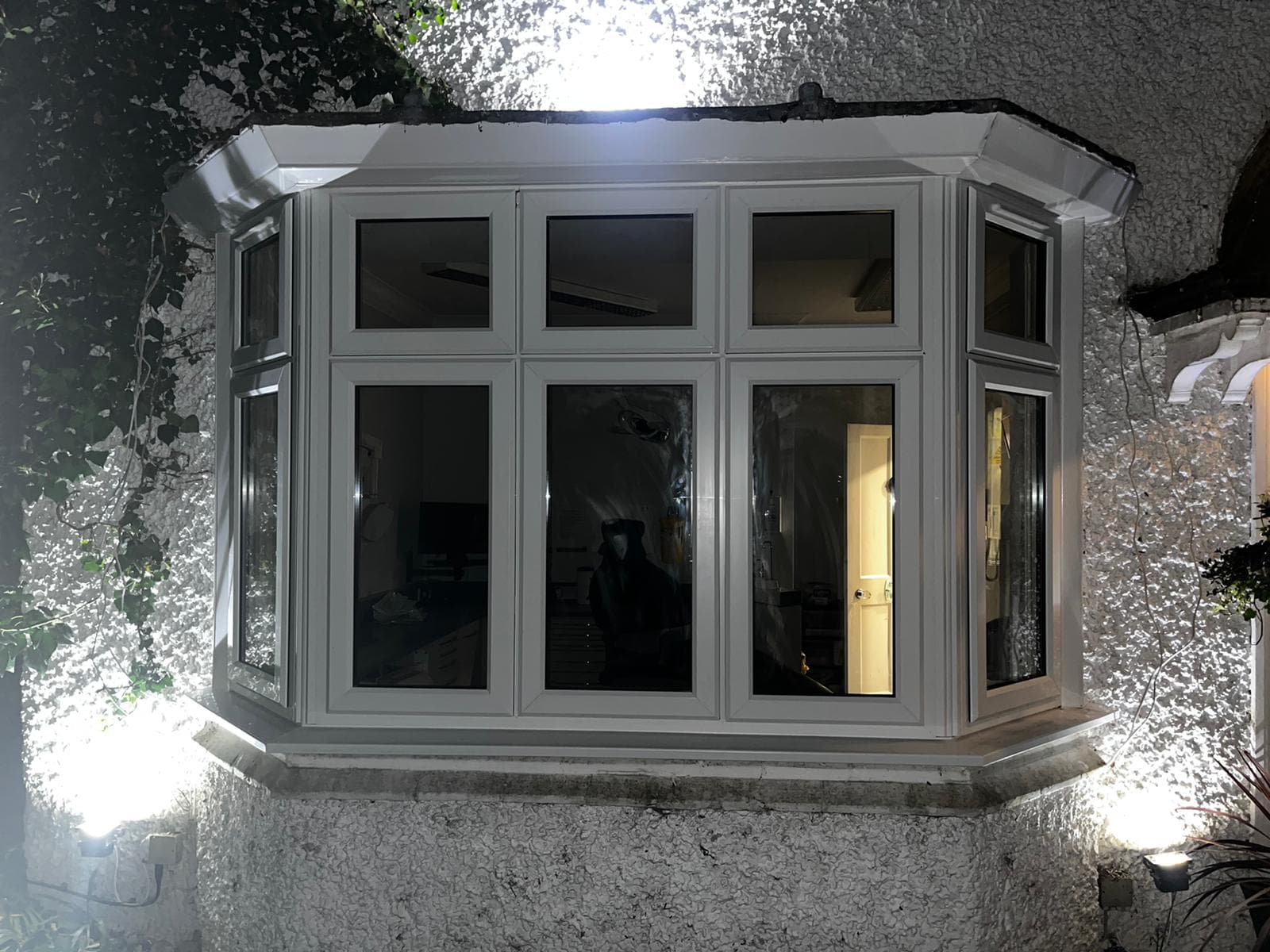 Bay window illuminated at night