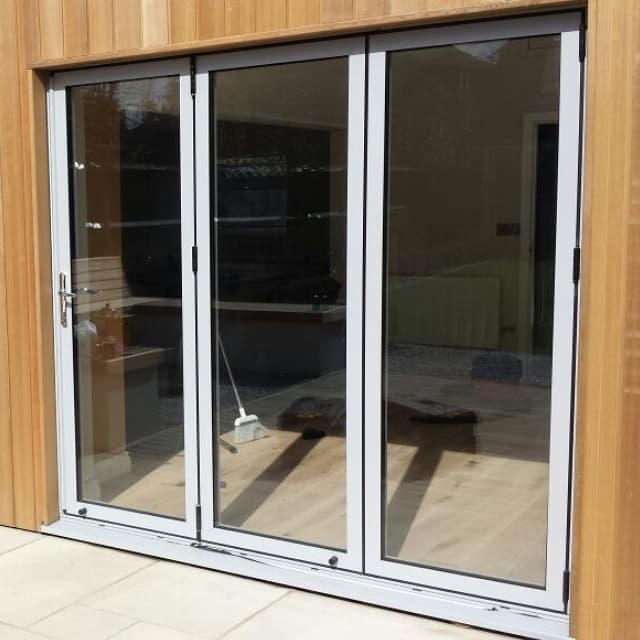 Cedar garden house with bifold doors