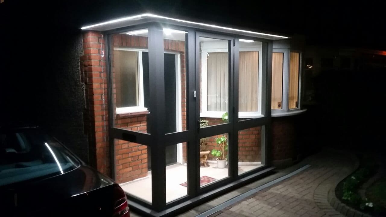 Aluminium porch illuminated at night