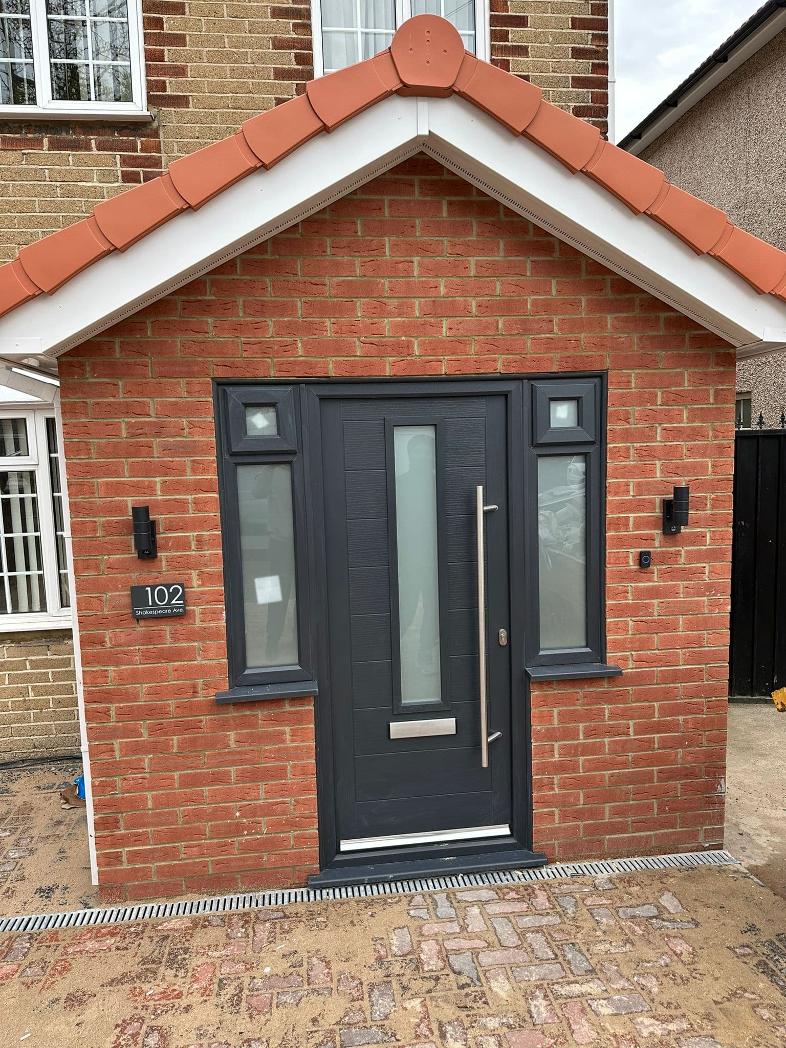 Composite door in brick porch