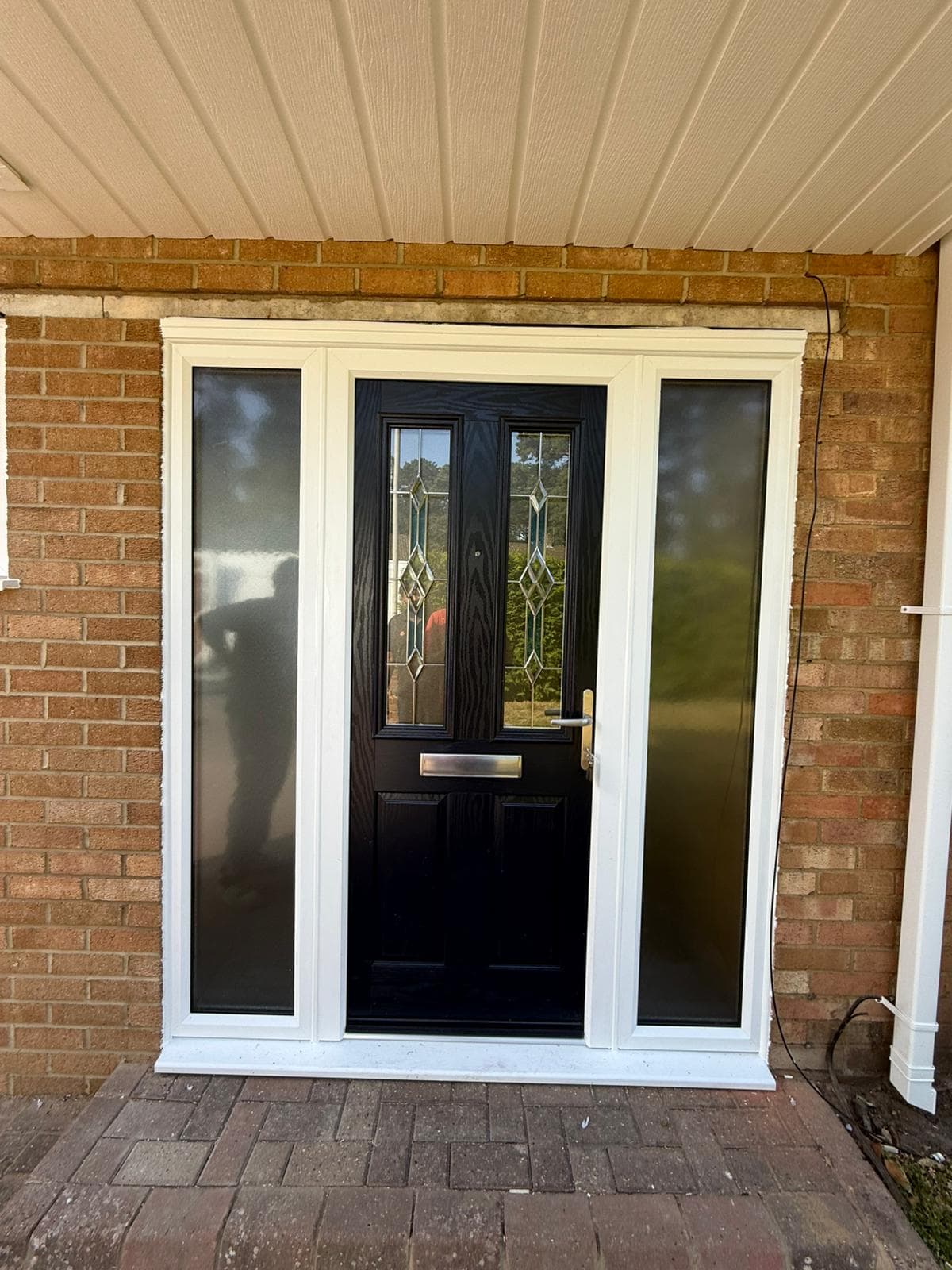 Composite door with stained glass