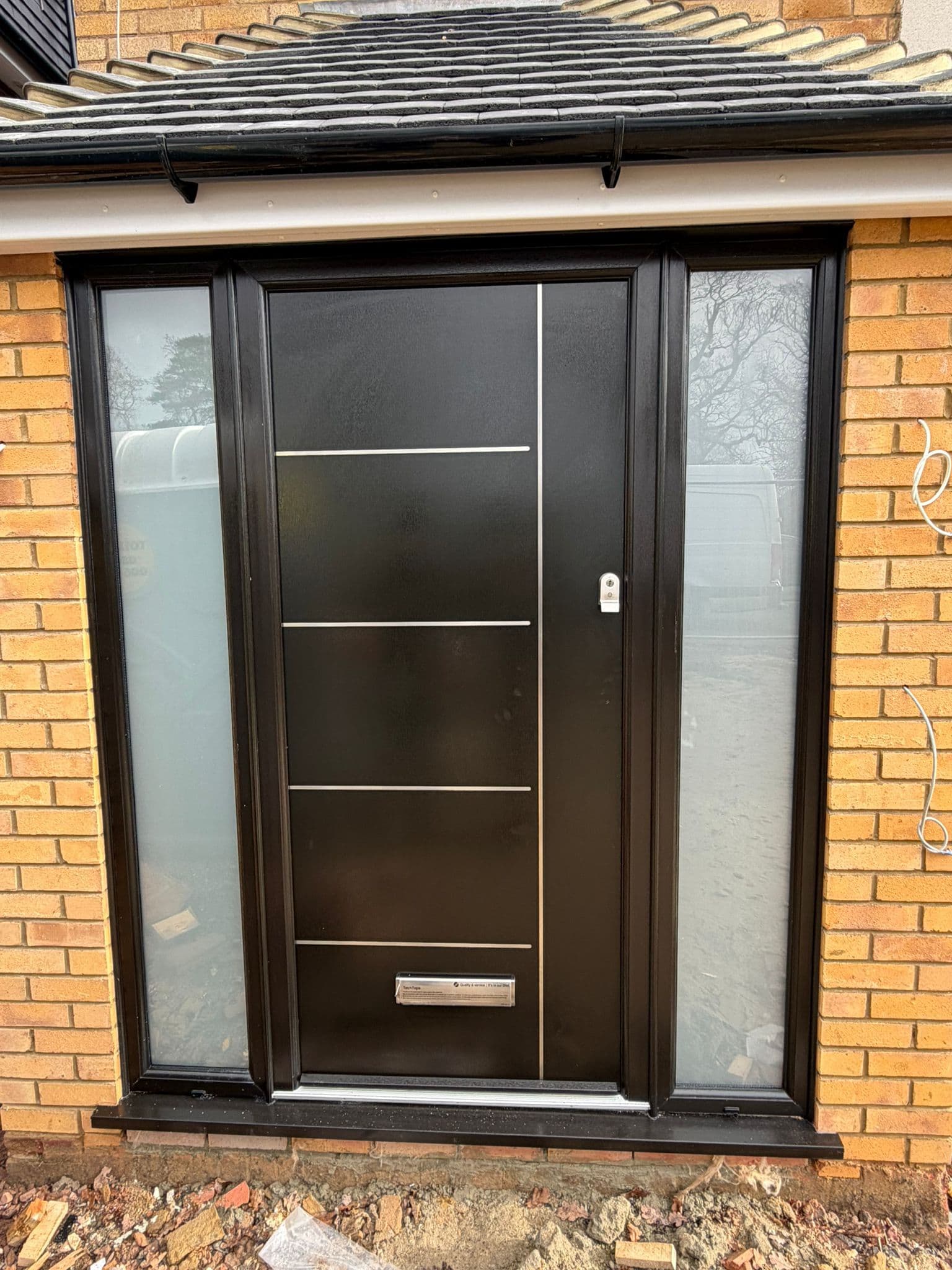 Palladio composite entrance door with contemporary black finish and sidelights