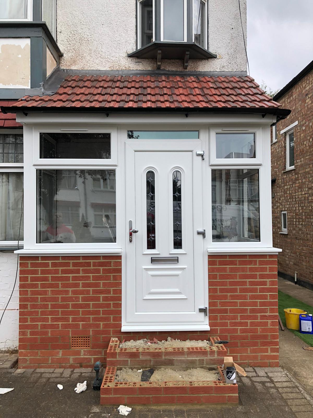 White uPVC porch with composite entrance door